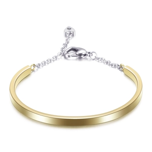 U-shaped stainless steel bangle with a two-tone gold and silver chain and heart charm