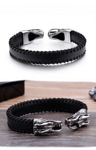 Macro view of leather dragon head bracelet featuring black stitching and silver metal detail