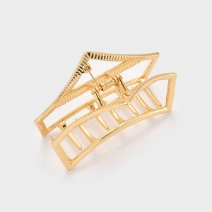 Detailed view of the large hollow geometric hair claw made of durable gold metal