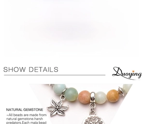 Detail view of 8mm Amazonite bead bracelet with tree of life and starfish charms