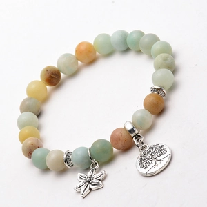 Detail shot of matte Amazonite beads and silver tree of life charm on yoga bracelet