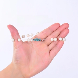 Detailed close-up showing high-stretch elastic rope with white stone beads for durability
