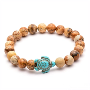 Detailed view of turtle bead bracelet with natural brown stone and blue turquoise turtle charm