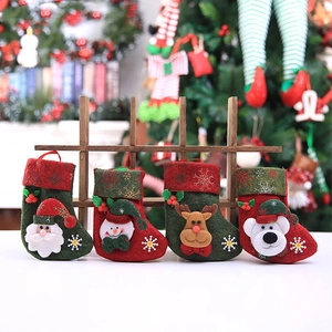Set of 4 Christmas stockings with Santa, Snowman, Reindeer, and Bear on a festive tree