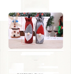 Detail of Christmas gnome wine bottle covers in red and grey knit fabric, 14x30cm size