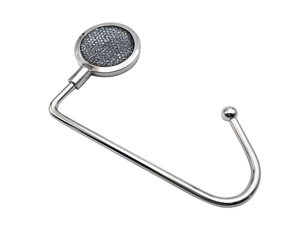 Close-up of silver metal desk hook with dark grey textured inlay for heavy bags