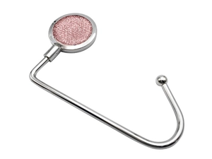Detailed close-up of a silver metal desk hook with a sparkling pink glitter inlay top