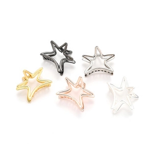 Detail view of five-pointed star hollow metal hair claws in diverse metallic finishes