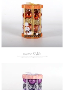 Detail of Christmas tree ornaments in transparent gift box featuring glitter and matte finish