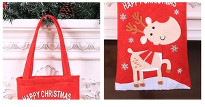 Detail of red Christmas wine bag with embroidered reindeer and Happy Christmas text