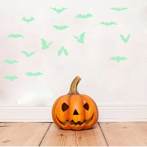 Luminous Halloween decorations featuring orange pumpkin lantern and green bat wall stickers
