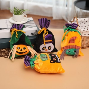 Detail of velvet Halloween drawstring gift bags with pumpkin and skull embroidery