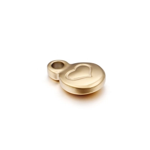 Polished gold circular stainless steel pendant with engraved heart detail and top bail