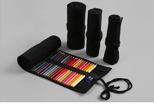 Detail of rolled and flat canvas pencil wraps showing elastic loops and secure straps