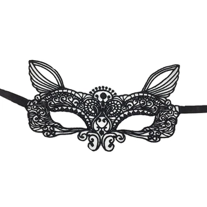 Detailed close-up of black lace cat-ear masquerade mask with adjustable ribbon ties