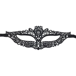Close-up of elegant black lace masquerade mask with intricate floral patterns and ribbons