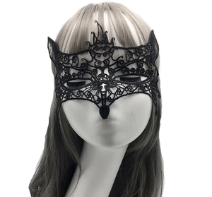 Close-up of black lace fox mask with intricate embroidery for masquerade parties