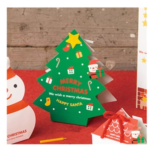 Christmas tree shaped green paper gift boxes with Santa and snowman patterns for holiday sweets