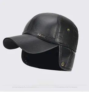 Detail of black leather winter baseball cap featuring foldable ear flaps and sports badge