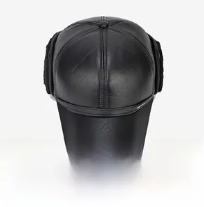 Top view of black leather baseball cap with detailed stitching and plush ear flaps