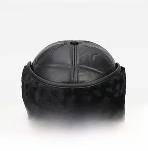 Rear view of black leather winter hat featuring thick faux fur lining and plush trim