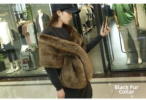Detail view of faux fur shawl in brown with black tips on a female model shoulder