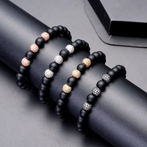 Matte black stone beaded bracelet set with micro-pave zircon spheres on display stand