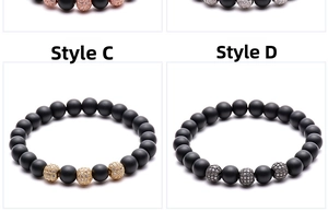Detail of matte black stone beads with gold and silver cubic zirconia accent balls