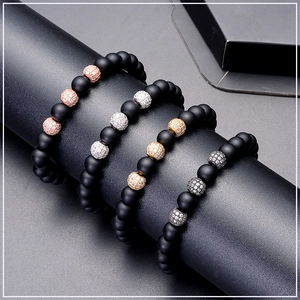 Macro shot of 8mm matte black stone bracelets with micro-pave zircon metal beads