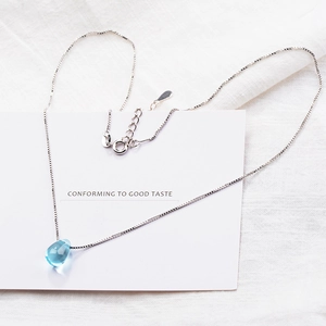 Elegant silver box chain necklace featuring a light blue teardrop crystal pendant