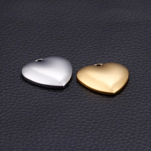 Polished heart-shaped stainless steel pendants in gold and silver finish for DIY jewelry