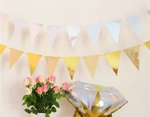 Detail showing gold and blue wave pattern bunting banners with party decor props