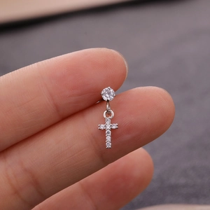 Detail of silver stainless steel cross earring with micro-set cubic zirconia crystals