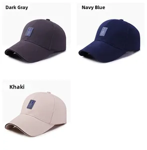 Detail view of cotton baseball caps in dark grey, navy blue, and khaki colors