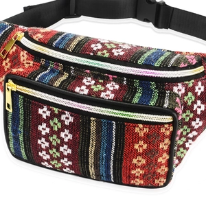 Close-up of bohemian style waist bag showing colorful ethnic pattern and gold zipper detail
