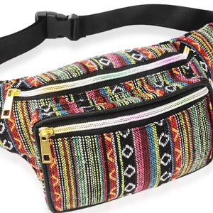Detail of colorful woven bohemian waist bag with gold zipper and adjustable black strap
