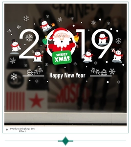 Detail of Santa Claus train and Merry Christmas stickers on festive glass window display