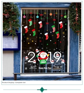 Detail of Santa Claus and snowman window stickers with Merry Christmas and 2019 lettering
