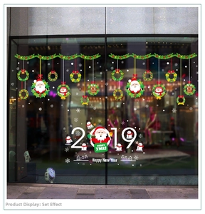 Christmas window decals set featuring Santa Claus, snowman, and Merry Xmas text on glass