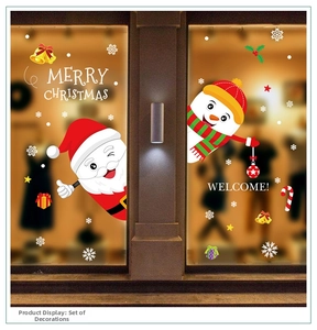 Detail of Santa and Snowman window decals with Merry Christmas text on glass doors