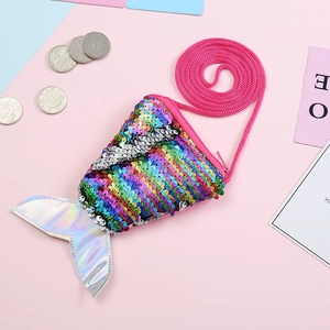 Close-up of mermaid tail coin purse with rainbow sequins and silver laser fin detail