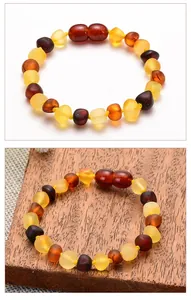 Detailed view of multi-color Baltic amber beads bracelet with irregular polished shapes