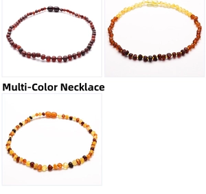 Close-up of Baltic amber necklaces showing different bead colors and natural textures