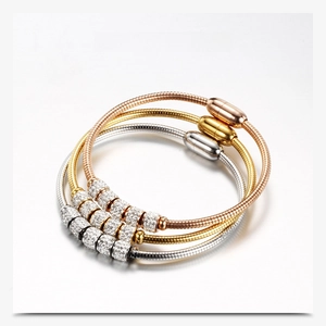 Detailed view of 3mm snake chain bracelets in gold, silver, and rose gold with rhinestones