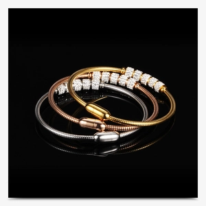 Detailed view of three 3mm cubic zirconia snake chain bracelets with magnetic clasps