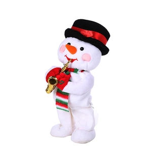 Detail of plush snowman toy with black hat and red scarf playing golden saxophone
