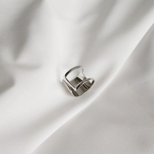 Detail shot of the S925 sterling silver geometric open ring on white silk background