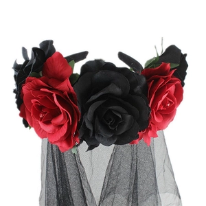 Close-up of gothic rose headpiece with red and black flowers and sheer mesh veil detail