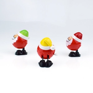Detailed view of plastic wind-up Santa toys in various colors from multiple angles