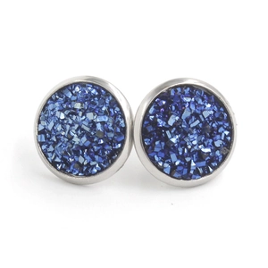 Macro shot of 12mm blue crystal stud earrings with sparkling silver plated borders
